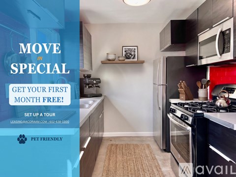 A kitchen with a red wall and a sign offering a free month.