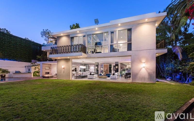 A modern house with a well-lit interior is available for sale.