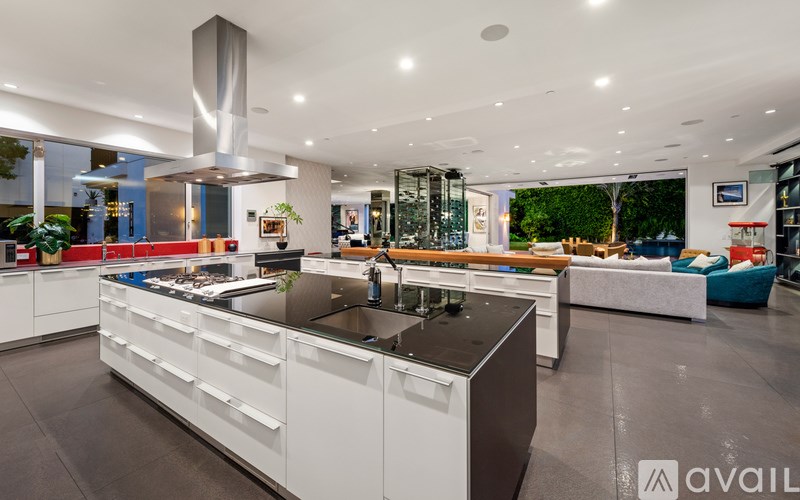 A modern kitchen with a large island in the center.