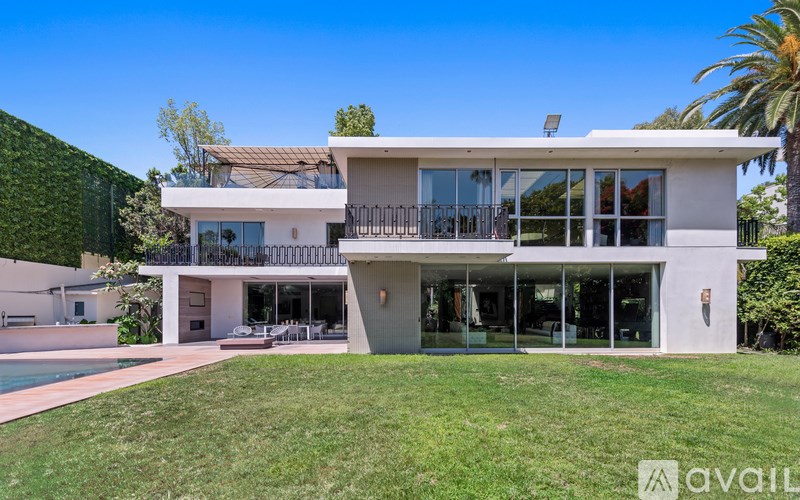 A modern house with a pool in the backyard.