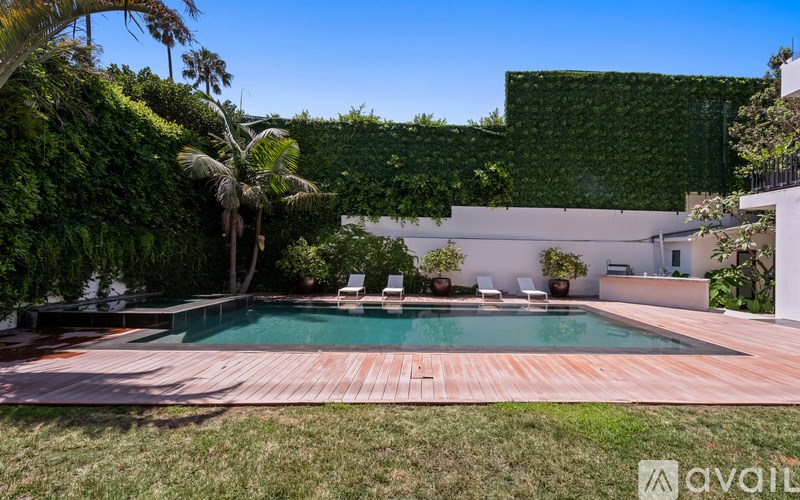 A modern house with a pool in the backyard.