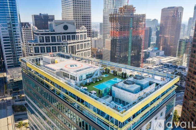 A view of a cityscape with a large building in the foreground.