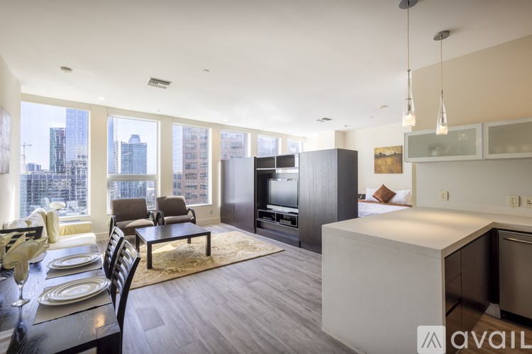 A modern kitchen with a dining table set for four.