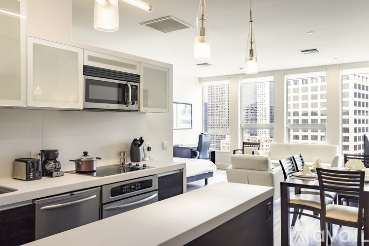 A modern kitchen with a view of the city.
