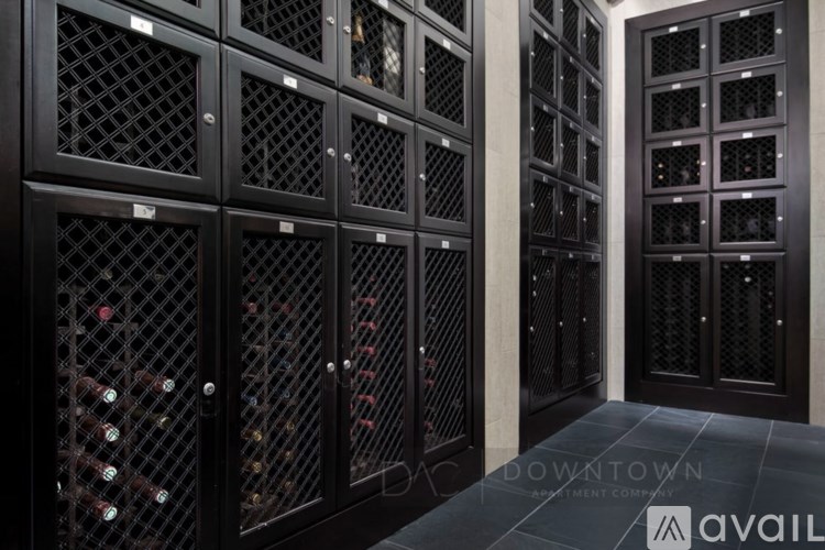 A wine cellar with rows of wine bottles.