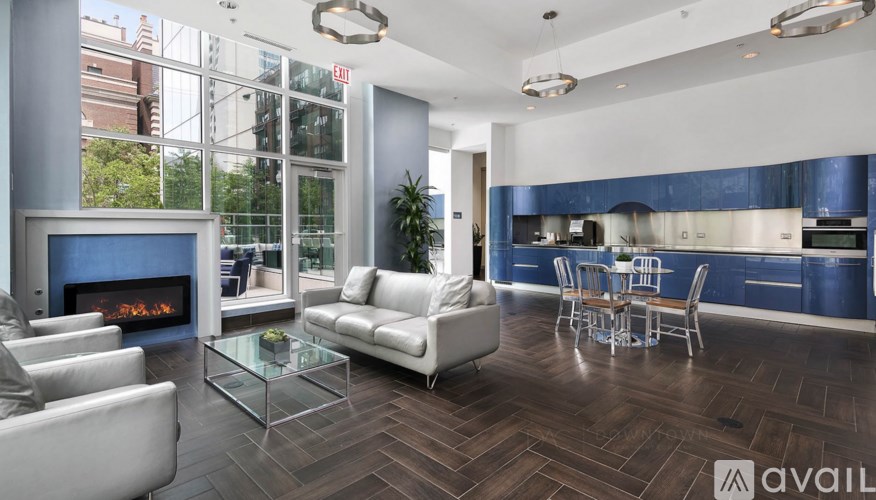 A modern living room with a fireplace and a dining table.