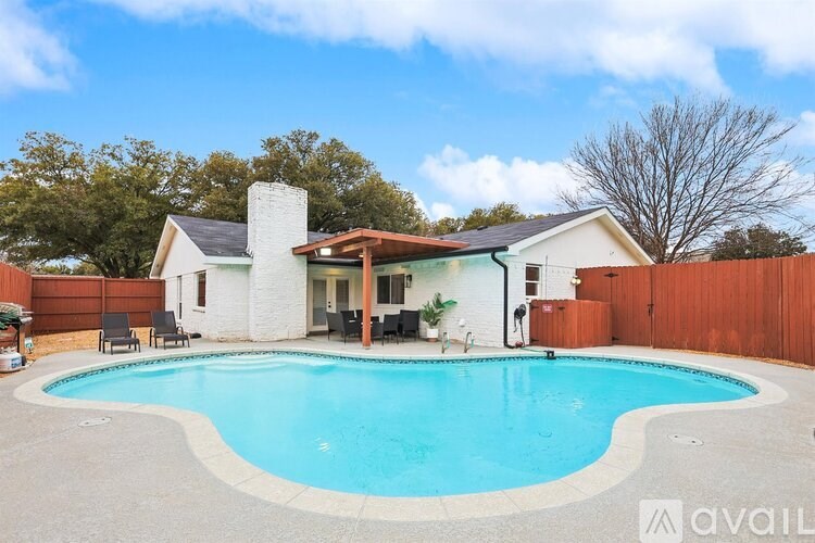 A house with a pool in the backyard.