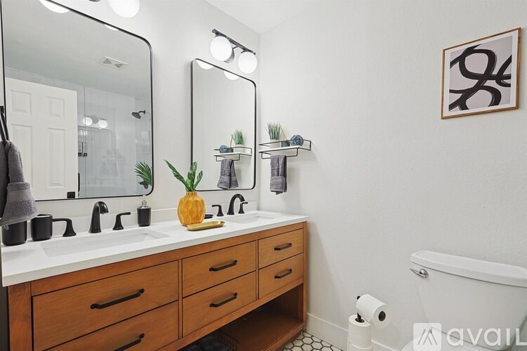 A bathroom with a pineapple on the counter.