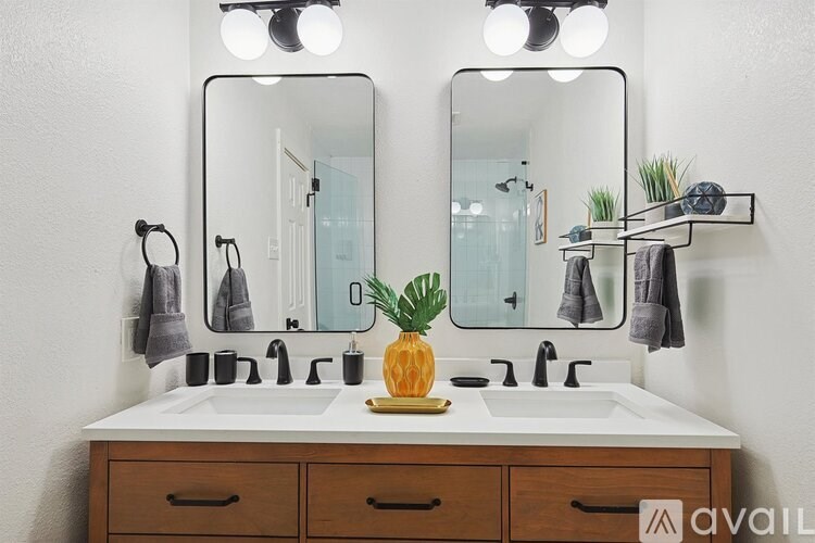 A bathroom with a pineapple on the counter.