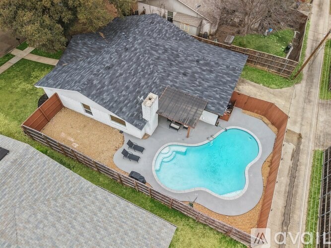 A house with a pool in the backyard.