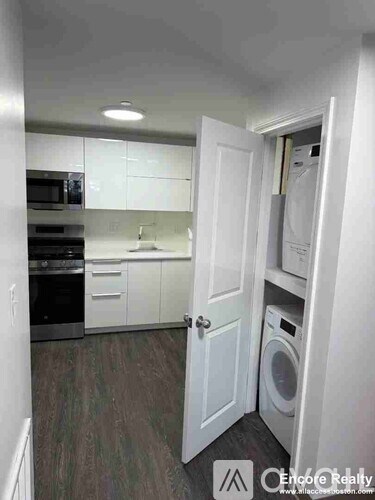 A laundry room with a washer and dryer in it.