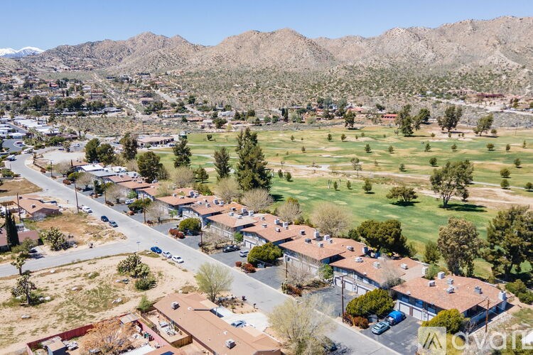 A small town with a mountain in the background.