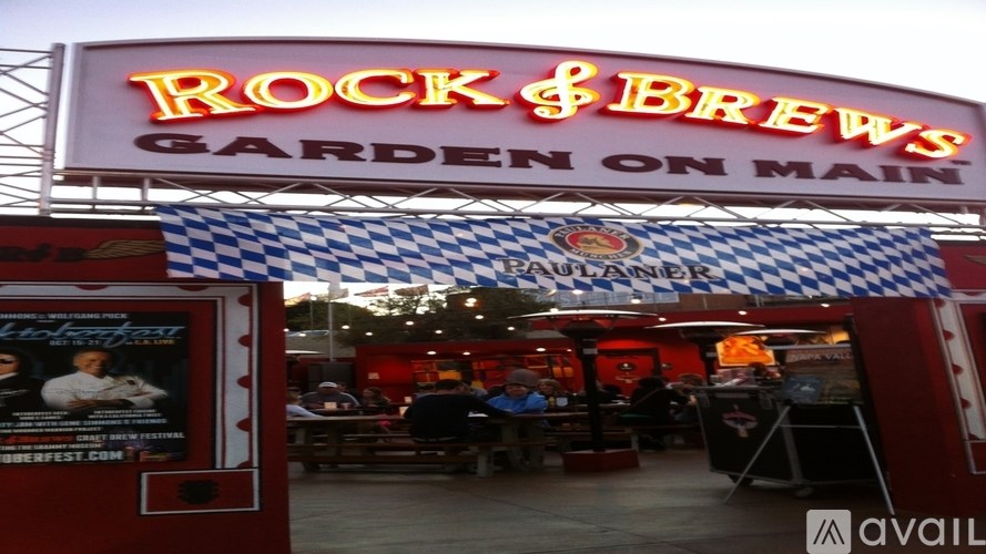 A neon sign for Rock & Brews Garden on Main.