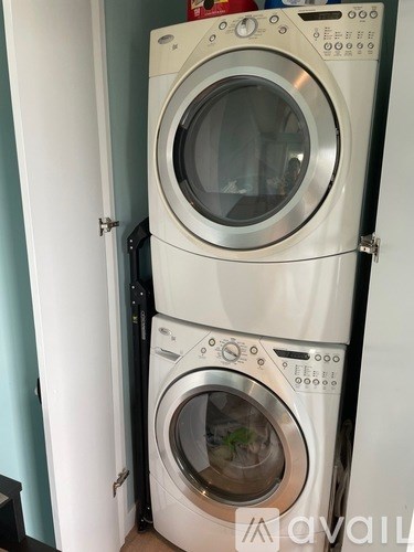 Two washing machines stacked on top of each other.