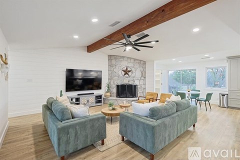 A living room with two couches and a television.