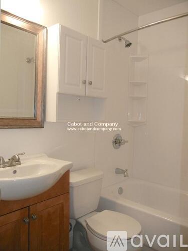 A bathroom with a sink, toilet and bathtub.