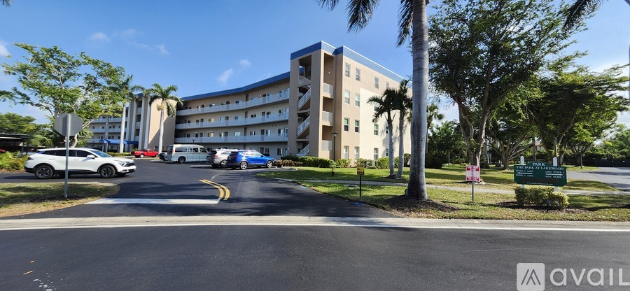 A large building with a parking lot in front of it.
