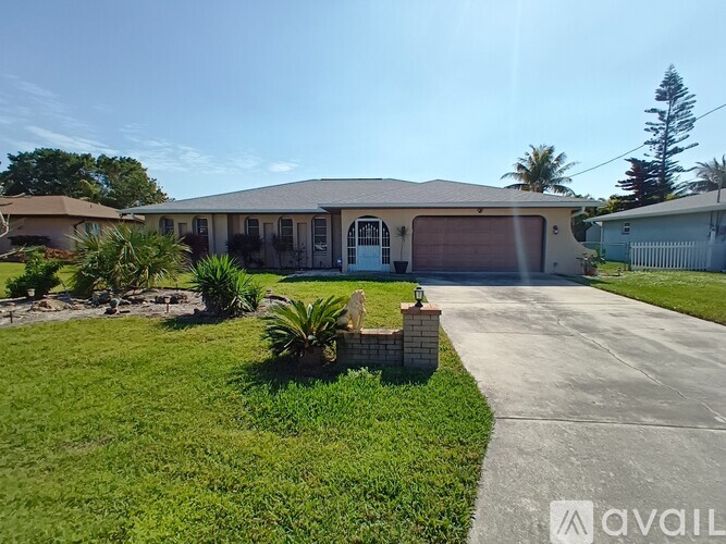 A house with a driveway and a garage door.