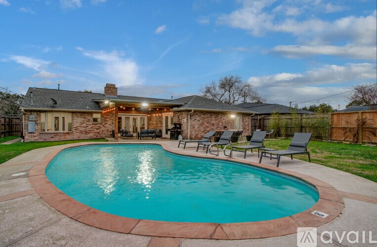 A house with a pool in the backyard.