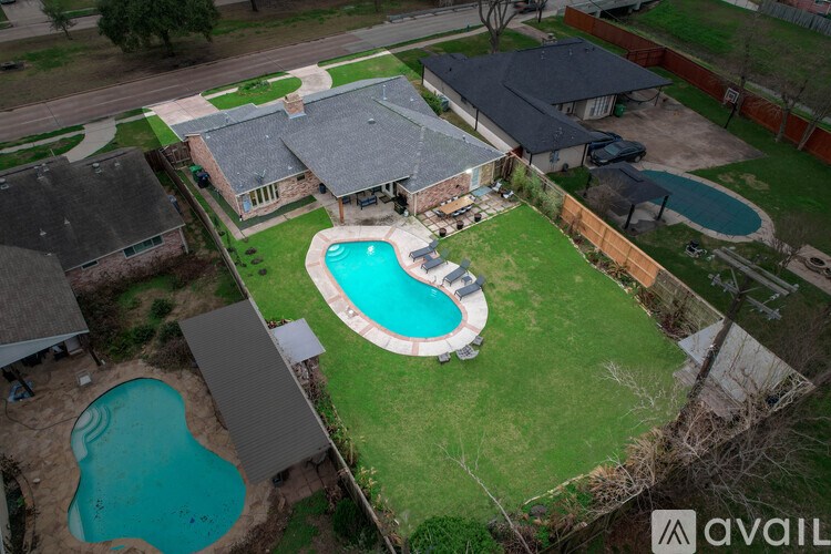 A house with a pool in the backyard.