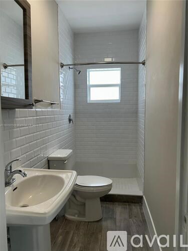 A bathroom with a white toilet and sink.