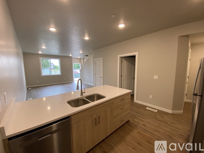 A kitchen with a sink and a window.
