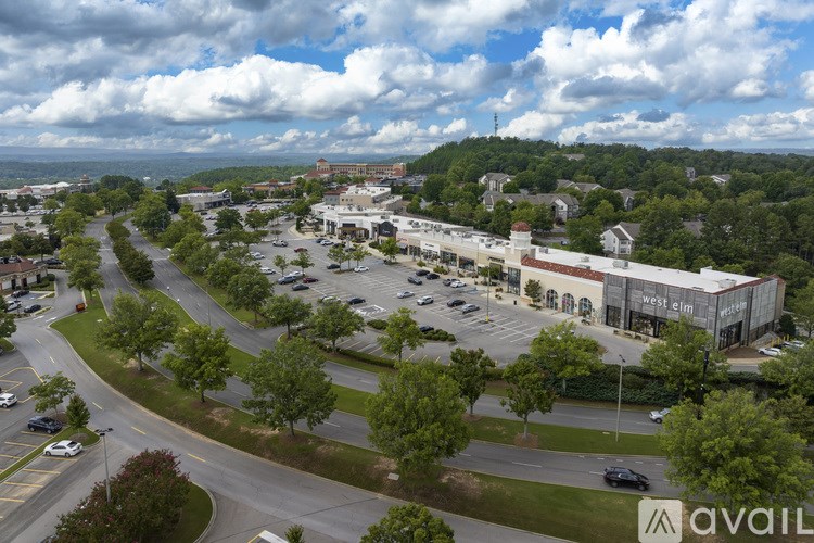 A parking lot with a building named West Clinic in the background.