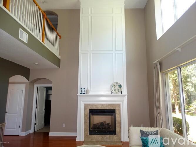 A living room with a fireplace and a couch.