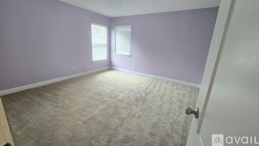A kitchen with wooden cabinets and granite countertops.