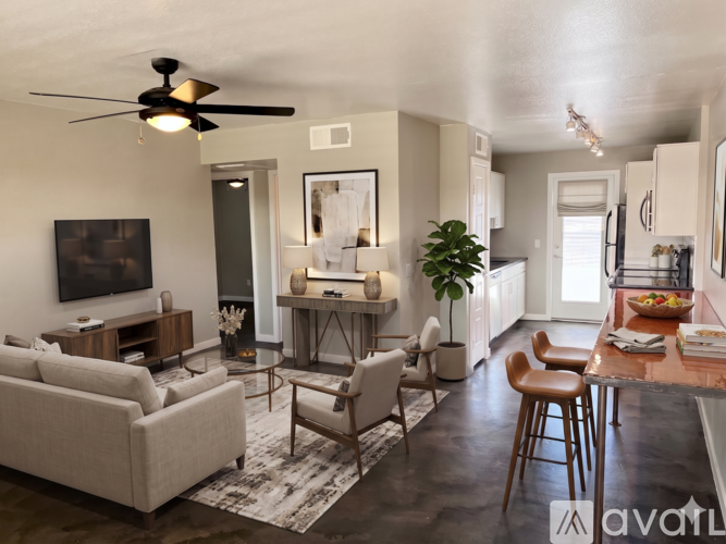 A kitchen with a ceiling fan and a countertop.