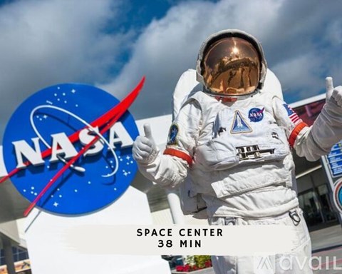 An astronaut stands in front of the NASA logo, ready for a 38-minute space center tour.