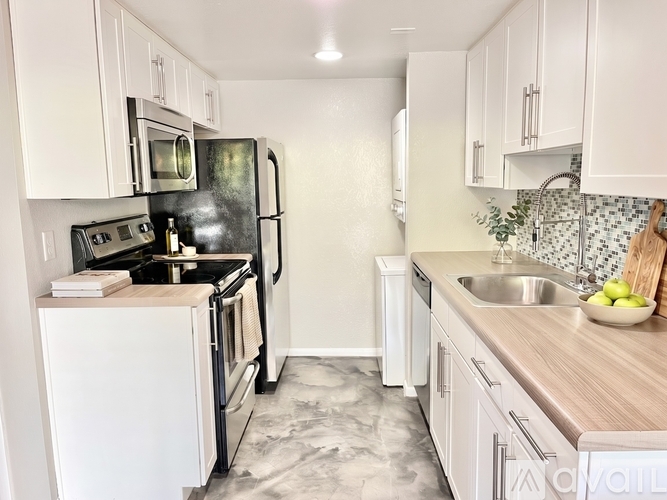 A kitchen with a sign offering a free first month for moving in.