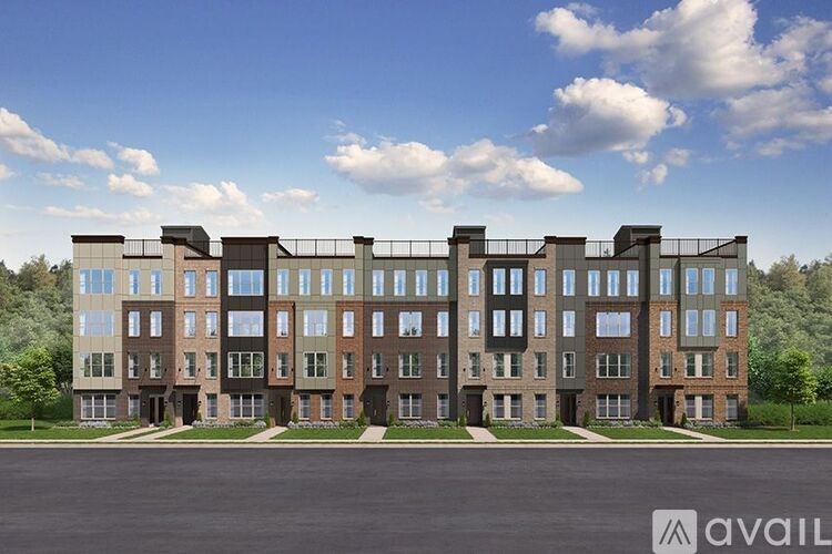 A large, modern building with a row of windows on the ground floor and balconies on the upper floors.