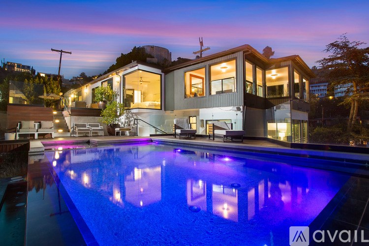 A modern house with a pool in the backyard.