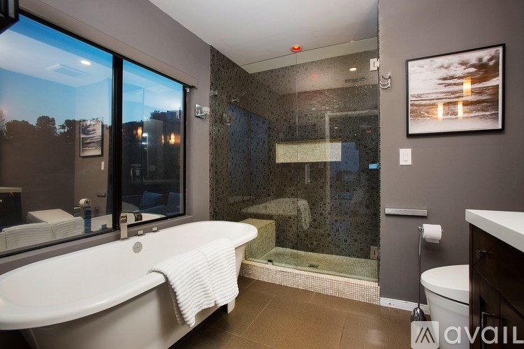 A bathroom with a large tub and a walk-in shower.