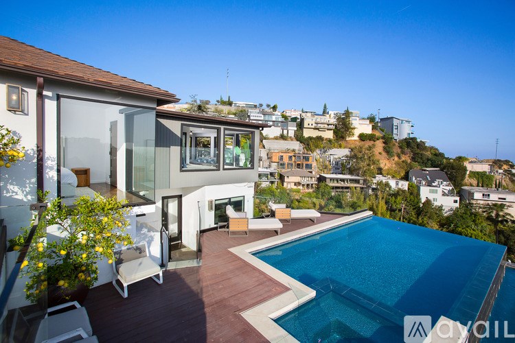 A modern house with a pool in the backyard.