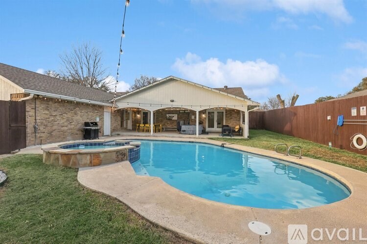 A house with a pool in the backyard.