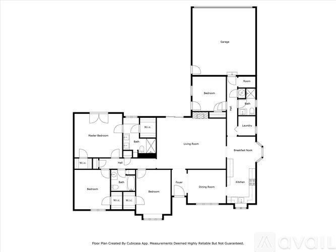 A floor plan of a house with rooms labeled, including a garage, living room, dining room, kitchen, and bathrooms.