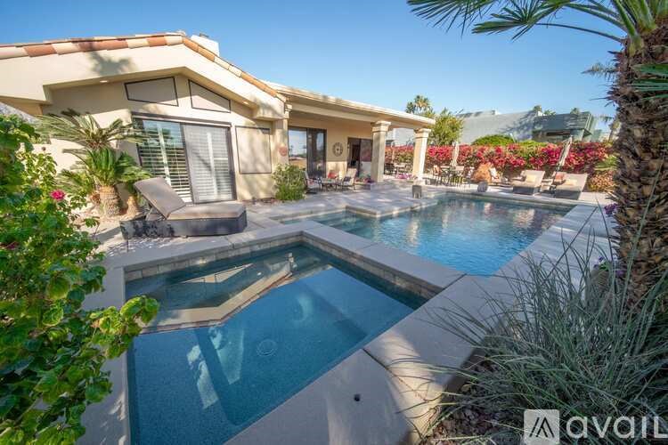 A house with a pool in the backyard.