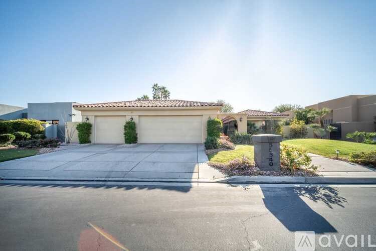 A house with a driveway in front of it.