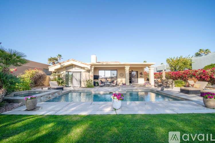 A house with a pool in the backyard.