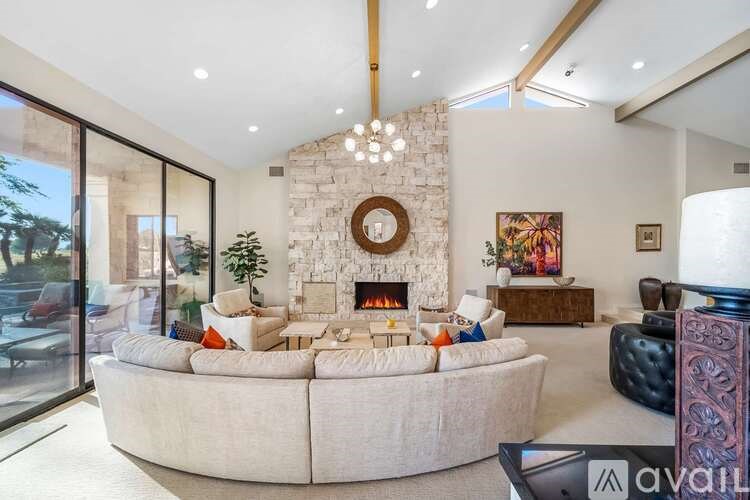 A living room with a fireplace and a couch.
