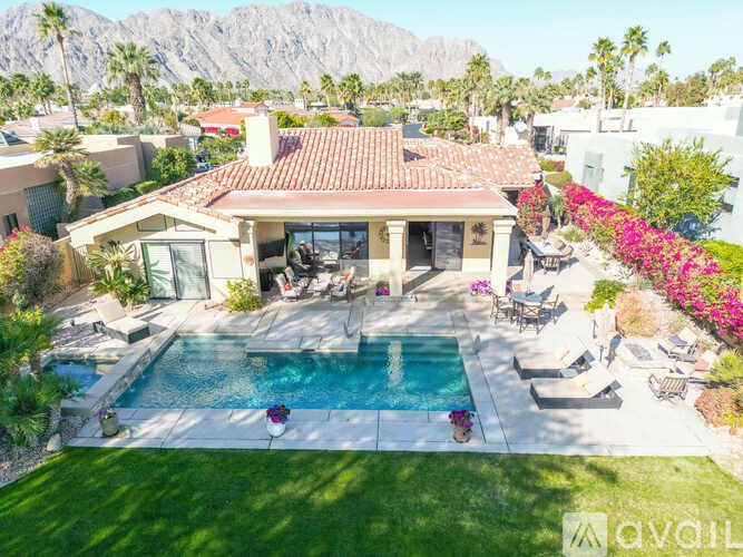 A house with a pool in the backyard.
