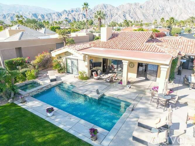 A house with a pool in the backyard.