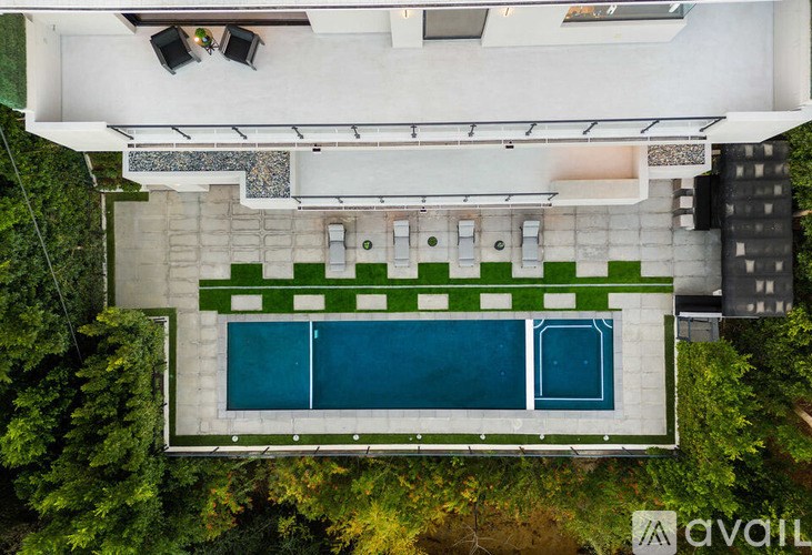 A modern house with a pool in the backyard.