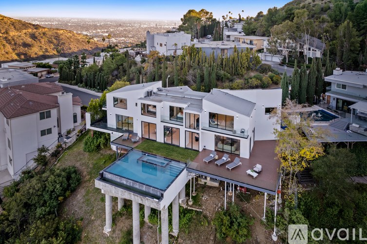 A modern house with a pool in the backyard.