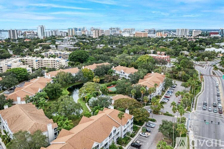 A bird's eye view of a residential area with houses and a road.