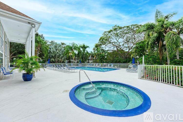 A pool with a slide in the middle of it.