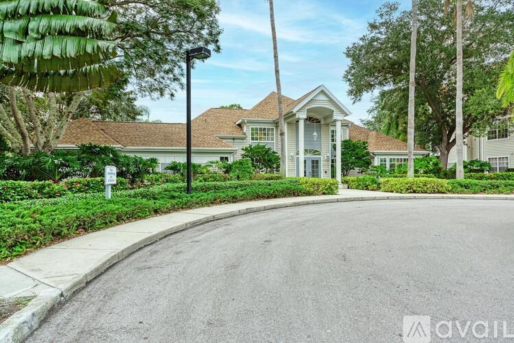A house with a driveway in front of it.