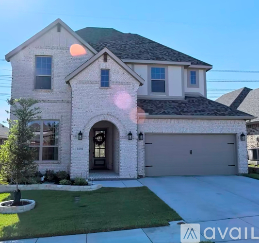 A house with a garage and a driveway is available for sale.